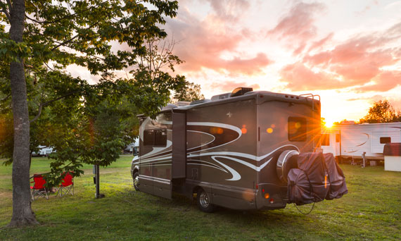 RV at a campsite during sunset