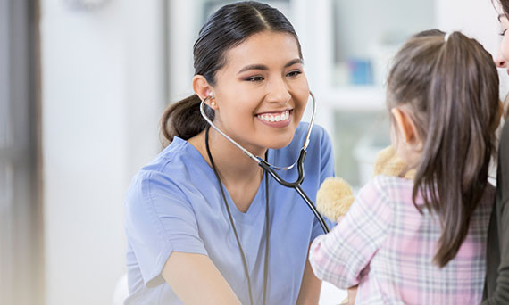 Nurse examining a young child